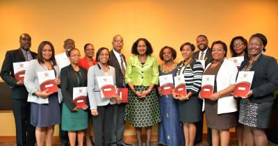 Senator the Honourable Jennifer Baptiste Primus (centre) with the newly appointed HIV Workplace Advocacy Advisory Board, from L-R: Simon Wiltshire, Izola Garcia, Brother Noble Khan, Violet Joseph, Cheryl Martyr, Natalie Willis (Chairperson and Permanent Secretary (Ag.), Dr. Keven Antoine, Aileen Clarke, Beryl Riley, Terrence Beepath, Heather Rodney, Gwendoline McLaren, Dr. Tracie Rogers. Missing: Colin Mills, Ariel Pino