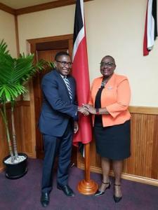 The Honourable Camille Robinson-Regis, Minister of Planning and Development and Mr. Selwin Hart, newly appointed Executive Director for the Caribbean Constituency at the Inter-American Development Bank meet each other at the Ministry of Planning and Development in the Eric Williams Finance Building.