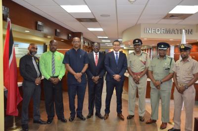 Caption: Minister of Housing and Urban Development, the Honourable Randall Mitchell (5th from left) and Minister of National Security, Major General (ret'd) the Honourable Edmund Dillon (4th from left) with members of the Joint Protective Service Housing Committee. (Photo courtesy the Ministry of Housing and Urban Development)