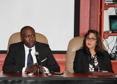 Caption: The Minister of Public Administration and Communications, the Honourable Maxie Cuffie (left) addresses the media and members of staff at the newly-established Ministry of Public Administration and Communications. Looking on, is the Permanent Secretary in the Ministry of Public Administration and Communications, Ms. Angela Edwards.