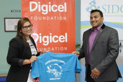 Caption: Senator Avinash Singh, Parliamentary Secretary in the Ministry of Agriculture, Land and Fisheries (right), strikes a pose with the Chief Executive Officer of the Seafood Industry Development Company Limited (SIDC), Ms. Nalini Sooklal following the launch of the SIDC’s Youth Fishing Clinic held on June 15, 2016, at its Charlieville Head Office. (Photo courtesy the Ministry of Agriculture, Land and Fisheries)