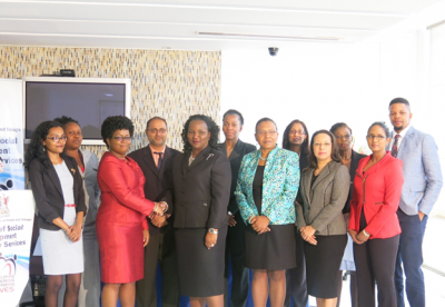 Ready to assist: (centre)Minister of Social Development and Family Services, the Honourable Cherrie-Ann Crichlow-Cockburn congratulates Ms. Hyacinth Blake (Chairperson), Director, Social Investigations Division, Ministry of Social Development and Family Services. Minister Crichlow-Cockburn is flanked (r) by Jacinta Bailey-Sobers and Natasha Barrow, Permanent Secretaries in the Ministry of Social Development and Family Services and other appointees of the Inter-Ministerial Research Council.