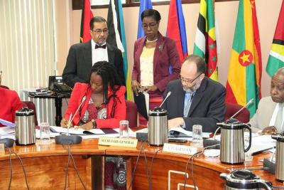 Caption: CARICOM Secretariat and UN Women sign MOU: L-R (sitting): UN-Women rep. Ms. Toni Brodber CARICOM Secretary-General, Amb. LaRocque & Hon. Carl Greenidge, Minister of Foreign Affairs, Guyana and Chair of the Community Council. L-R (standing) Mr. Neville Bissember and Barbara Vandyke, Office of the Secretary-General. (Photo courtesy the CARICOM Secretariat)