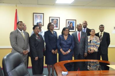 Caption: New HDC Board receive letters of appointment. (Front Row from left) Mr. Keith Scotland, Ms. Janice Clarence-Quamina (Board Members), Permanent Secretary of the Ministry of Housing and Urban Development, Ms. Joycelyn Hunte, Minister of Housing and Urban Development, the Honourable Marlene McDonald, Chairman of the Board, Newman George and Chandra Gokool. (Back Row from left) Mr. John Cardenas, Vice Chairman of the Board, Mr. Rasheedali Mohammed, Mr. Keli J.K. Gbekor and Mr. Bernard Mitchell.