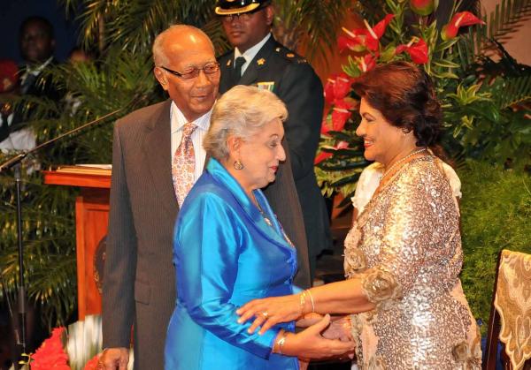 Retired Judge Gladys Gafoor who received the Public Service Medal of Merit (Gold) is congratulated by Her Excellency Mrs. Jean Ramjohn-Richards