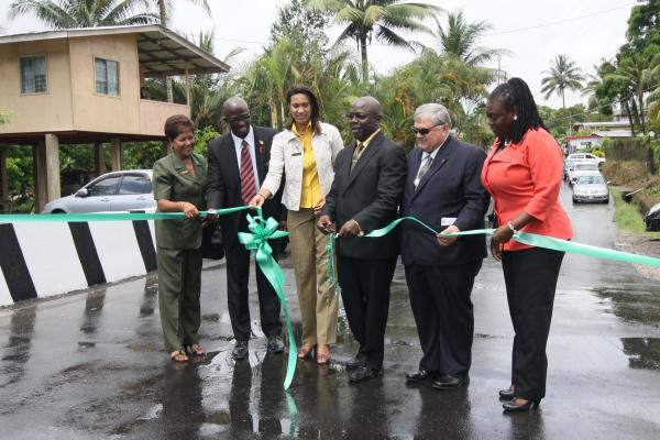 Caption: Dr. Lincoln Douglas, Minister in the Ministry of the People and Social Development and cuts the ribbon for the new bridge at the Arima Old Road, D'Abadie. He is assisted by Khadijah Ameen, Chairman of Tunapuna/Piarco Regional Corporation, Mayor of Arima Ghassan Youseph and Erwin Hope, Councillor for La Florissante/Clever. Caption: Dr. Lincoln Douglas, Minister in the Ministry of the People and Social Development and cuts the ribbon for the new bridge at the Arima Old Road, D'Abadie. He is assisted by Khadijah Ameen, Chairman of Tunapuna/Piarco Regional Corporation, Mayor of Arima Ghassan Youseph and Erwin Hope, Councillor for La Florissante/Clever.