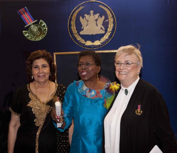 Recipients of the first time award, the Medal for the Development of Women (Gold) are left to right Brenda Gopeesingh; Hazel Brown and Diana Mahabir-Wyatt